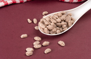 Roasted Crunchy Jowar and ragi - Indian Dietary Supplement, served in a bowl over moody background, selective focus.
