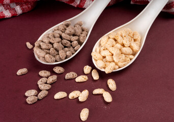 Roasted Crunchy Jowar and ragi - Indian Dietary Supplement, served in a bowl over moody background, selective focus.