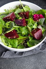 salad beet slice fresh beetroot mix green lettuce healthy meal food snack on the table copy space food background rustic top view keto or paleo diet veggie vegan or vegetarian food