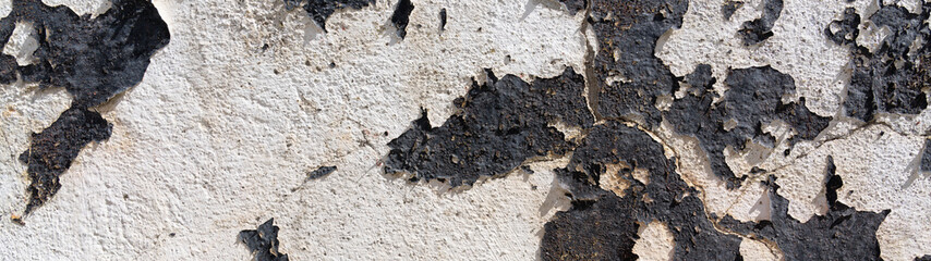black paint peeling off concrete