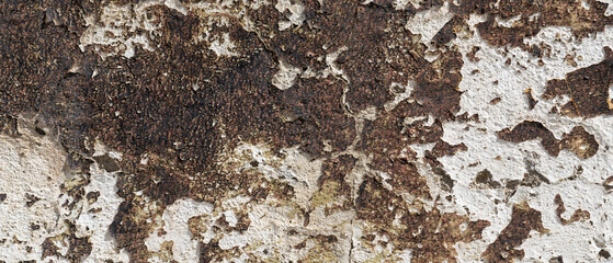 Old brown paint peeling off concrete