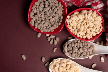 Roasted Crunchy Jowar and ragi - Indian Dietary Supplement, served in a bowl over moody background, selective focus.