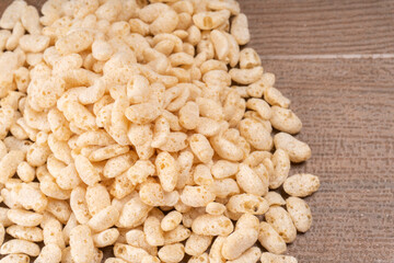 Roasted Crunchy Jowar and ragi - Indian Dietary Supplement, served in a bowl over moody background, selective focus.
