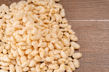 Roasted Crunchy Jowar and ragi - Indian Dietary Supplement, served in a bowl over moody background, selective focus.