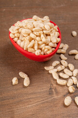 Roasted Crunchy Jowar and ragi - Indian Dietary Supplement, served in a bowl over moody background, selective focus.