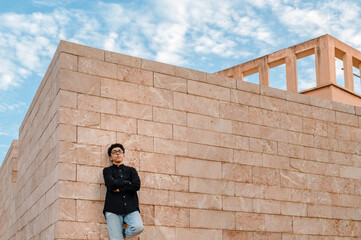 Confident transgender person looking at camera while posing outdoors.