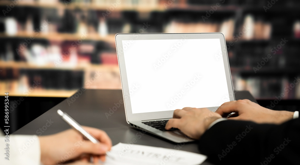 Poster empty laptop computer screen for astute design mockup on a table in library of university