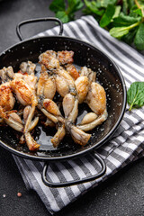 frog legs fried meat cuisine french food meal food snack on the table copy space food background...
