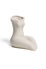 Close-up shot of a white empty ceramic female body shaped vase with a narrow neck isolated on a white background. Modern home decor element. Front view.