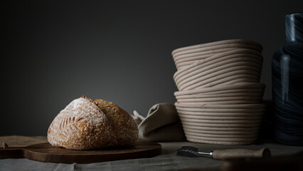 Artisan Batard Sourdough healthy Bread. Open crumb high hydration Sourdough french country bread set on dark background. - 587000140