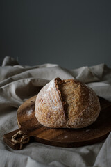 Artisan Batard Sourdough healthy Bread. Open crumb high hydration Sourdough french country bread set on dark background. - 587000186