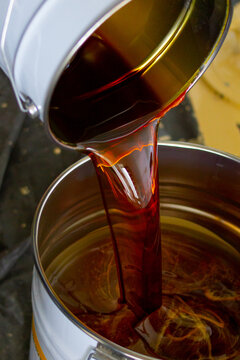 The chemical composite is being mixed carefully to prepare it for use with the epoxy resin.