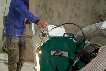 An industrial machine equipped with diamond discs is used to grind concrete floors to a smooth and even finish, preparing the surface for the application of new coatings.