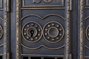 Antique keyhole on metal door. Old retro keyhole close up. Ancient lock of an old portal.