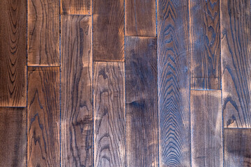 Dark Old parquet wooden texture. Natural wood shabby background close-up.