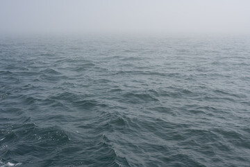 fog and waves on the sea
