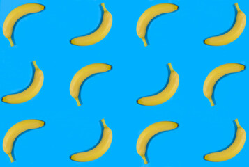 Banana on the blue background. Flat lay. Pattern. Top view.