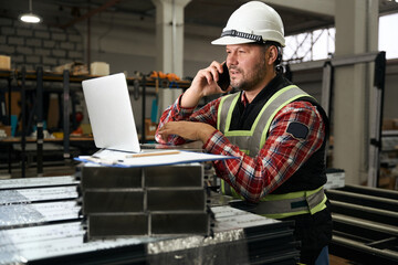 Portrait of man talking with client on phone