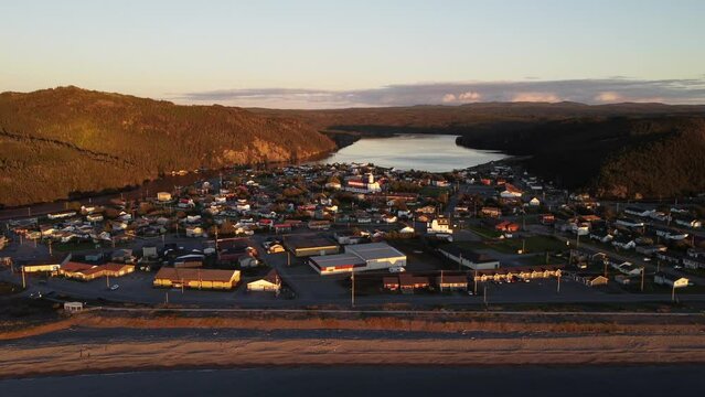 Aerial seaside town with historic church and landmarks under evening light at Placentia Newfoundland Canada.
