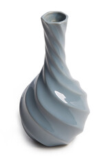 Close-up shot of a gray faceted ceramic vase. A small empty vase with a long narrow neck is isolated on a white background. Front view.