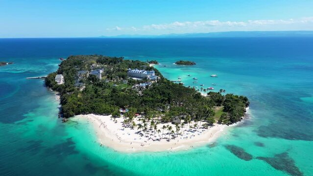 Tropical island Cayo Levantado. White sand beach, palm trees and turquoise Caribbean sea. Popular excursions to Samana, Dominican Republic