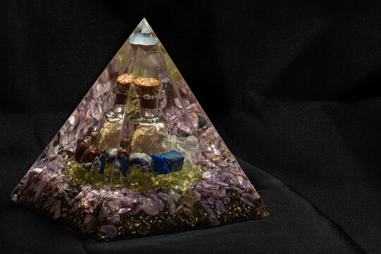 Large orgonite with silver bottle.