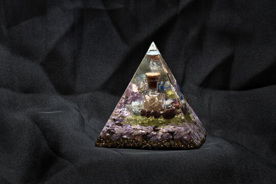 Large orgonite with silver bottle.