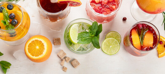 Set of various cocktails with fruits on white background.