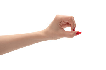 Woman hand with red nails holding something.