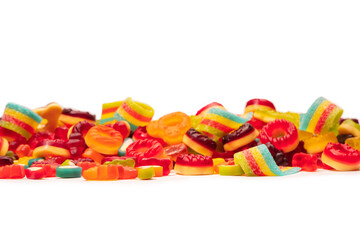 Assorted colorful gummy candies. Top view. Jelly donuts. Jelly bears. Isolated on a white background.