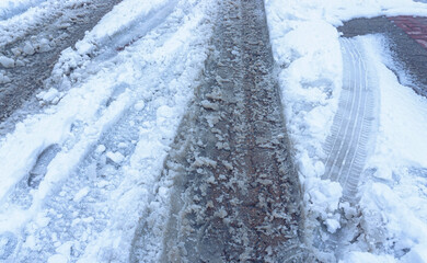 Slush on the pedestrian road, melted snow.