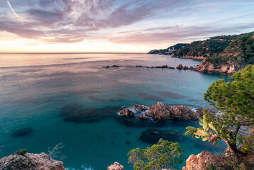 Fototapeta premium Sunrise over the Mediterranean Sea (Esculls de Canyet, Spain, Catalonia)