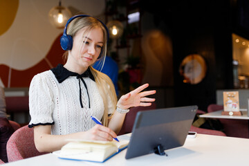 Businesswoman Yulia works remotely in a cafe