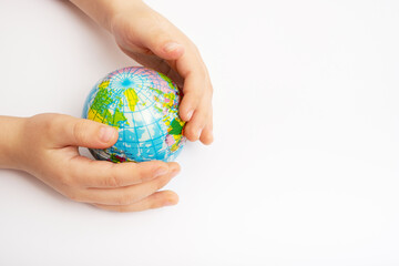 Environment for future, save the planet concept. World globe in child hands top view with copy space