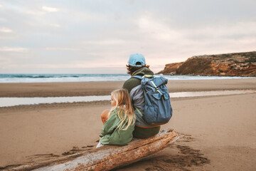 Father and daughter on the beach family vacations travel lifestyle together parent with kid...