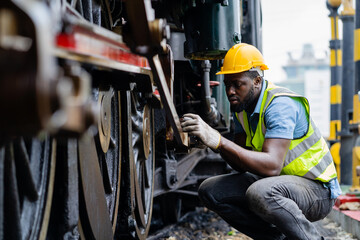 American engineer male engineer inspects and inspects trains and inspects work in a railway station...