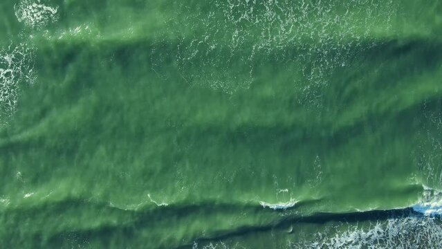 Top view of stormy sea and waves of Baltic sea. Looping Water surface texture landscape. Aerial drone view ocean waves