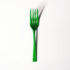 green fork on white background