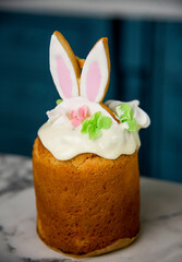 easter cake with rabbits ear on table in blue kitchen 