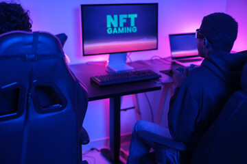 Two friends playing computer games online with virtual reality glasses. Concept: virtual games, technology, online