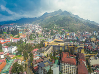 Aerial view of landscape at the hill town in Sapa city, Lao Cai Province, Vietnam in Asia with the sunny light and sunset, mountain view in the clouds