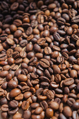 Coffee beans on crumpled brown paper, can be used as background