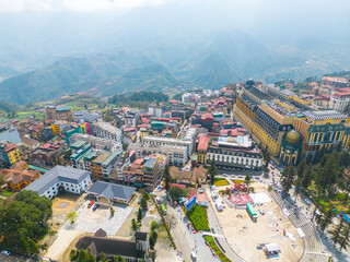 Aerial view of landscape at the hill town in Sapa city, Lao Cai Province, Vietnam in Asia with the sunny light and sunset, mountain view in the clouds