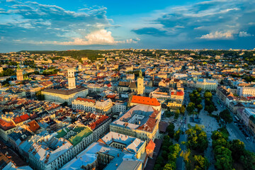 Rooftops of the old town in Lviv in Ukraine. The magical atmosphere of the European city. Landmark, the city hall and the main square. Drone photo.