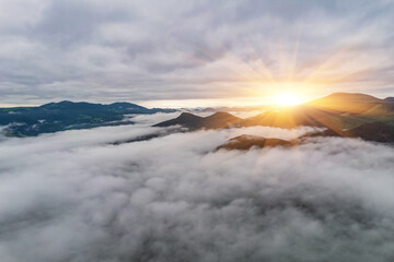 Peaceful scene of misty mountains. Location place of Carpathians mountains, Ukraine, Europe. Photo wallpaper. Aerial photography, top view drone shot.