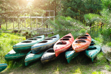 There are a lot of kayaks for a water hiking trip in a large group. Boat delivery and transportation, tourist service on a commercial trip