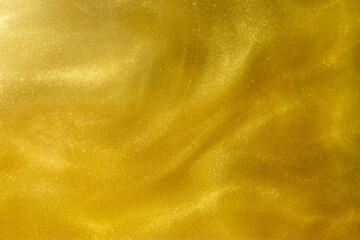 Yellow Golden Shiny Abstract Background. Paints, Acrylic, Glitter in Water. Yellow Golden Shiny...