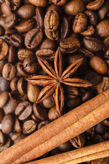 Coffee beans with spices anise and cinnamon. Top view. Closeup