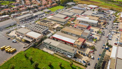 Aerial view of a large industrial area with warehouses and sheds.