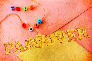 Old paper textured background with post envelope, paper, vintage card to write congratulations. Word Passover made of Matzoh - Jewish dry bread, Passover holiday symbol. Love beads